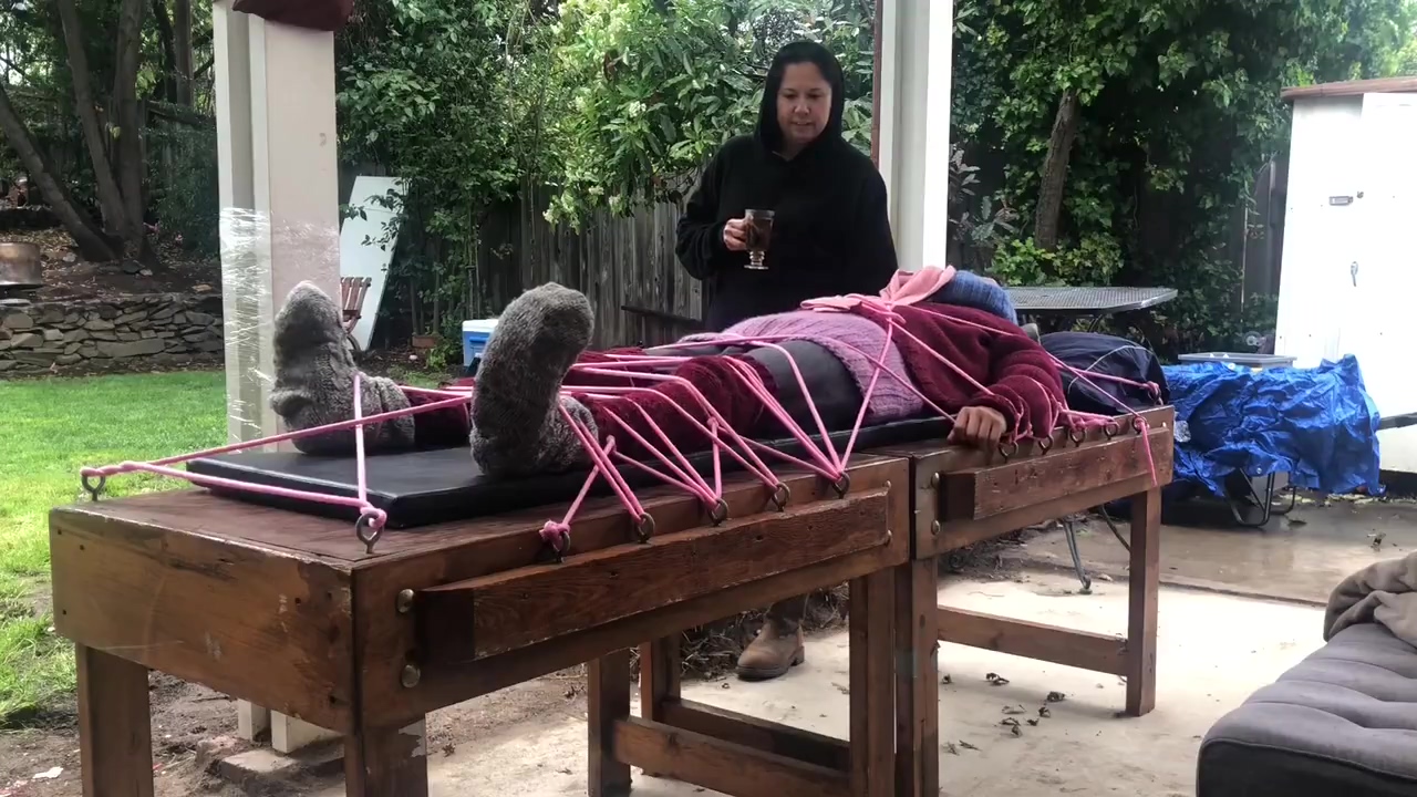 Wool Mohair Layers Of Sweaters On A Bondage Table
